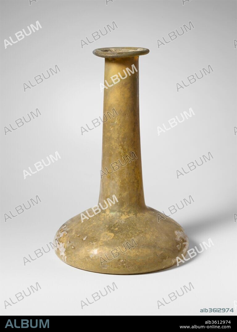 Glass perfume bottle. Culture: Roman. Dimensions: H.: 6 3/4 in. (17.1 cm). Date: 2nd-3rd century A.D..
Uncertain (colorless with yellow green tinge?).
Rim folded out, down, round, and pressed into mouth; tall cylindrical neck, expanding downwards; broad, bell-shaped body; concave bottom.
Intact; some bubbles; dulling, surfaces covered with weathering and iridescence.