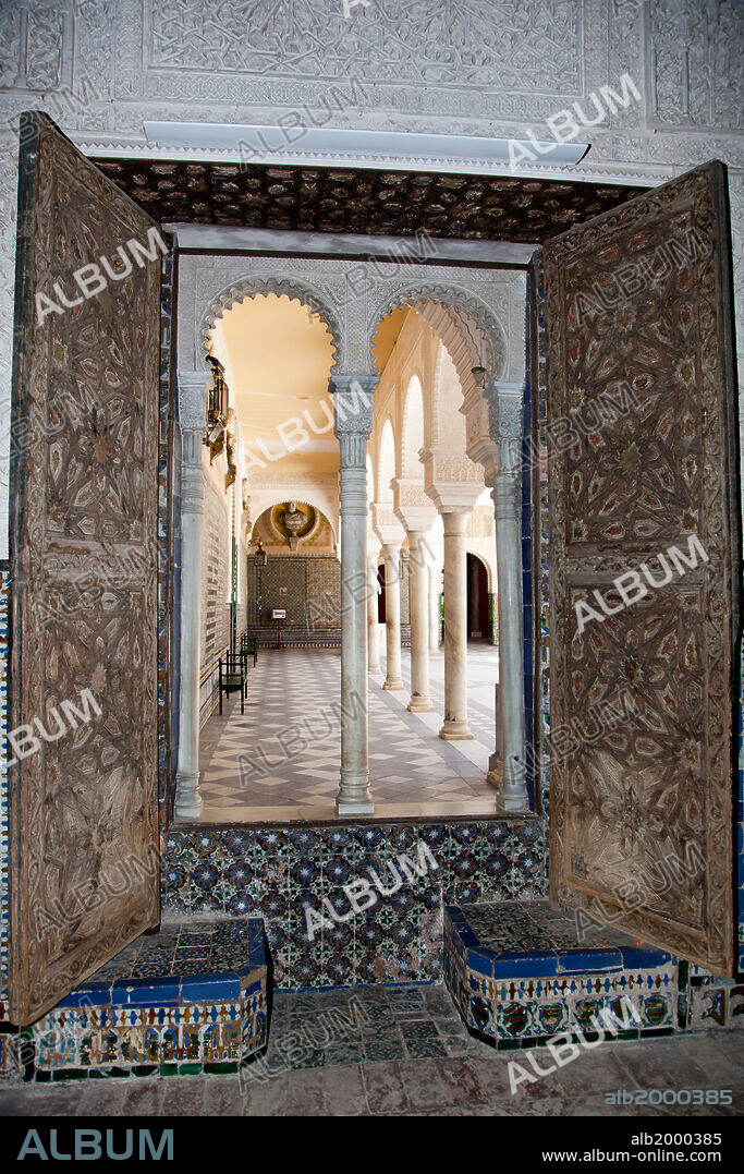 Spain, Andalusia, Sevilla, House of Pilate, Arched Door with Tiles. Plaza de Pilatos is actually an exquisite palace, ordered by Pedro Enriquez, head governor of Andalusia. It was designed as a copy of the praetory of the procurator of Judea, Pontius Pilate.