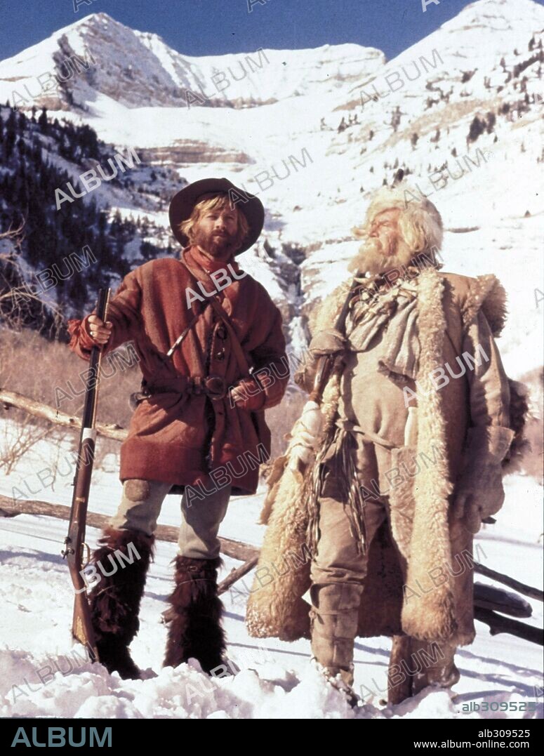 ROBERT REDFORD and WILL GEER in JEREMIAH JOHNSON, 1972, directed by SYDNEY POLLACK. Copyright WARNER BROTHERS.