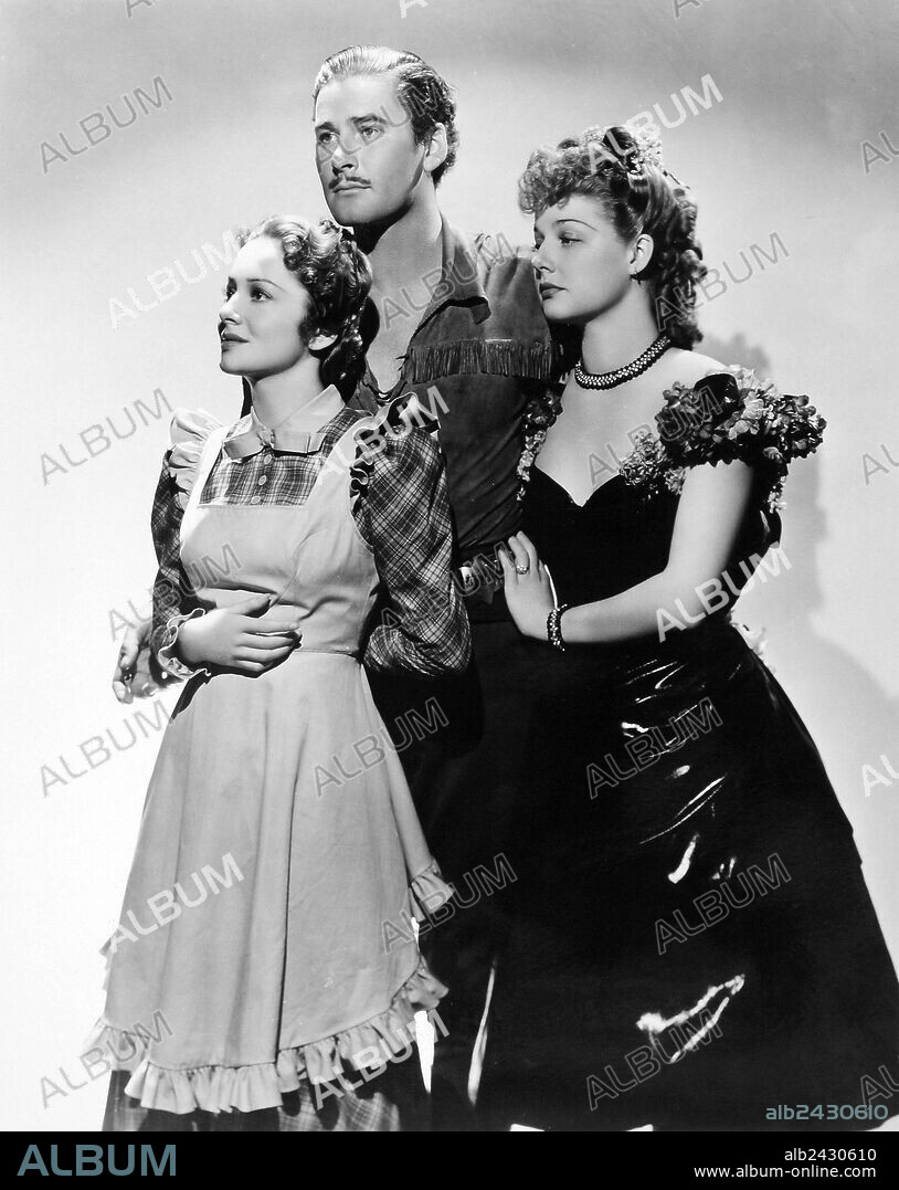 ANN SHERIDAN, ERROL FLYNN and OLIVIA DE HAVILLAND in DODGE CITY, 1939, directed by MICHAEL CURTIZ. Copyright WARNER BROTHERS.