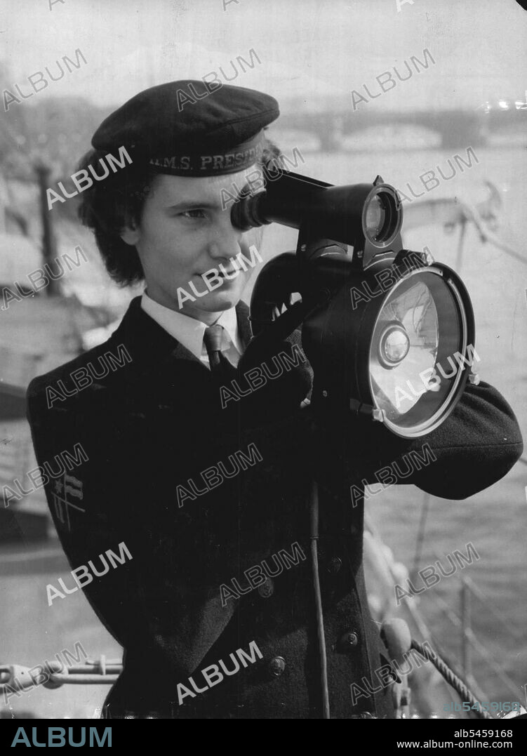 Signalling London - Signal when Valerie Lomax, 20, of Hove ***** the new Aldis Longrange signalling ***** aboard her ship HMS President to *****exchange massages with important London buildings on Thames side today Thursday.
The new lamp, five times more powerful than the previous model, is designed for ease of operation and to lessen ***** for the operator. A bulb ***** at full brilliance the whole *****, with signals made by a tubular shutter, which cuts off the light. The built-in telescopic sight enables the signaller to pick up a small target and helps in reading massages flashed at extreme ranges.
The new lamp, weighing 4¾ pounds, is robust, watertight, and proof against sea water coarosion. October 07, 1954. (Photo by Reuterphoto).