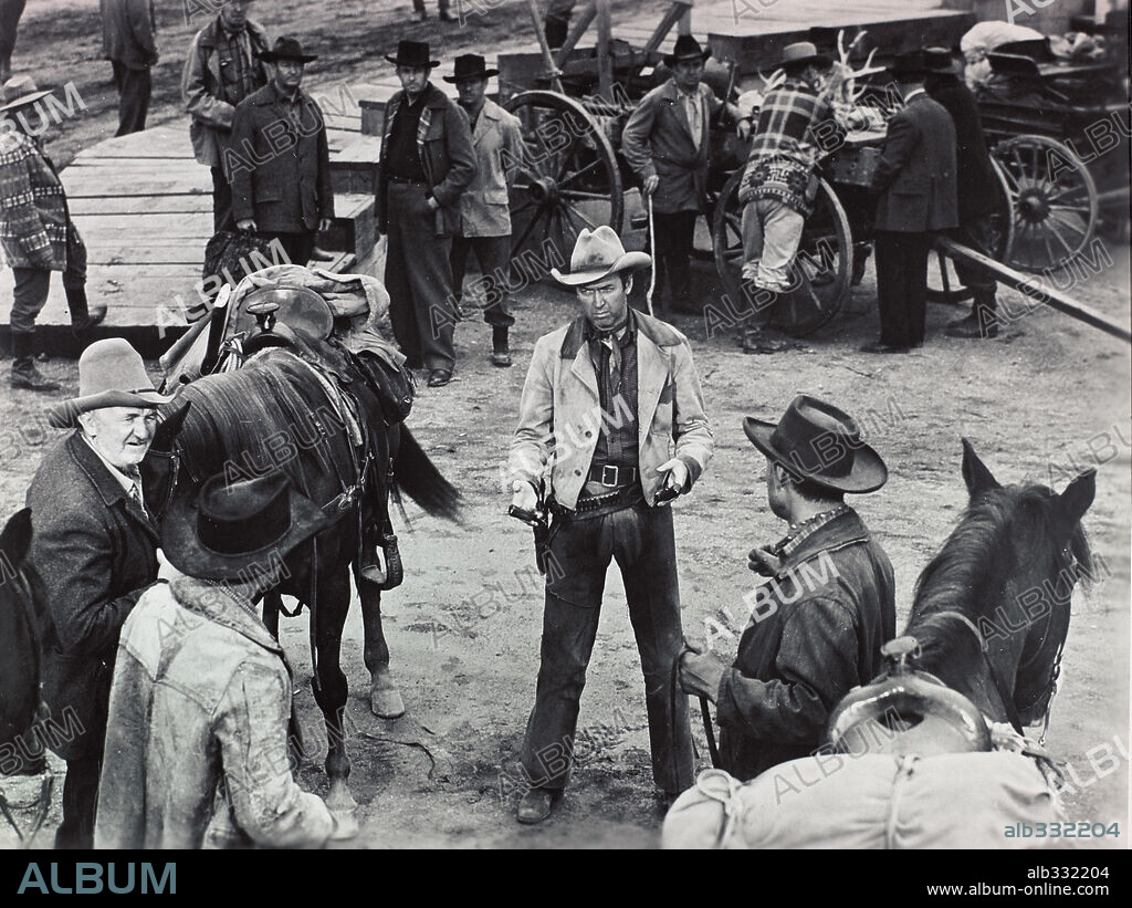 JAMES STEWART and WALTER BRENNAN in THE FAR COUNTRY, 1954, directed by ANTHONY MANN. Copyright UNIVERSAL PICTURES.