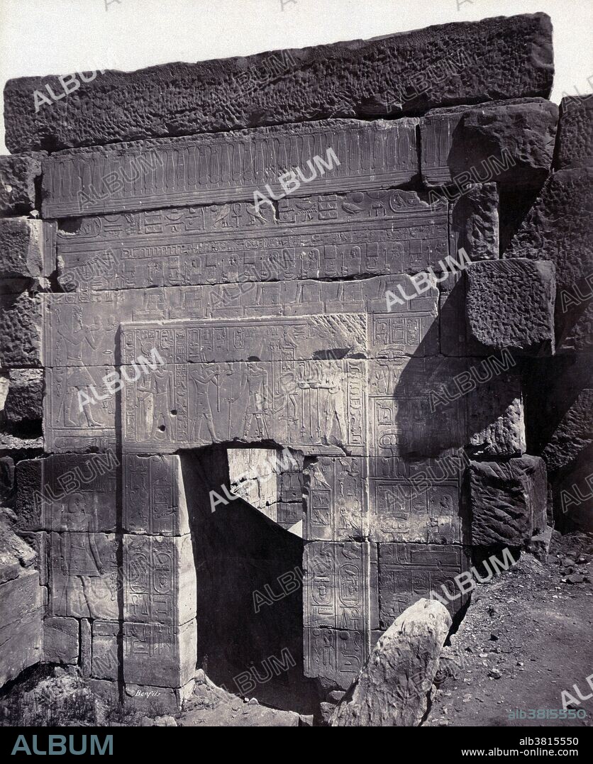 Entrance to sanctuary of the Temple of Thutmose III, Thebes, photographed by Maison Bonfils, circa 1867-1885. The Temple of Thutmose III at Deir el-bahari was dedicated primarily to the god Amun, both in the form of Amun-Re and Amun-Kamutef, and probably paid some role within the funerary cult of Thutmose III. The Karnak Temple Complex comprises a vast mix of decayed temples, chapels, pylons, and other buildings. Building at the complex began during the reign of Senusret I in the Middle Kingdom and continued into the Ptolemaic period, although most of the extant buildings date from the New Kingdom. The area around Karnak was the ancient Egyptian Ipet-isut (The Most Selected of Places) and the main place of worship of the eighteenth dynasty Theban Triad with the god Amun as its head. It is part of the monumental city of Thebes. The complex is a vast open-air museum and the largest ancient religious site in the world. FÃ©lix Bonfils (March 8, 1831 - 1885) was a French photographer and writer who was active in the Middle East. He moved his family to Beirut in 1867 where they opened a photographic studio called "Maison Bonfils".