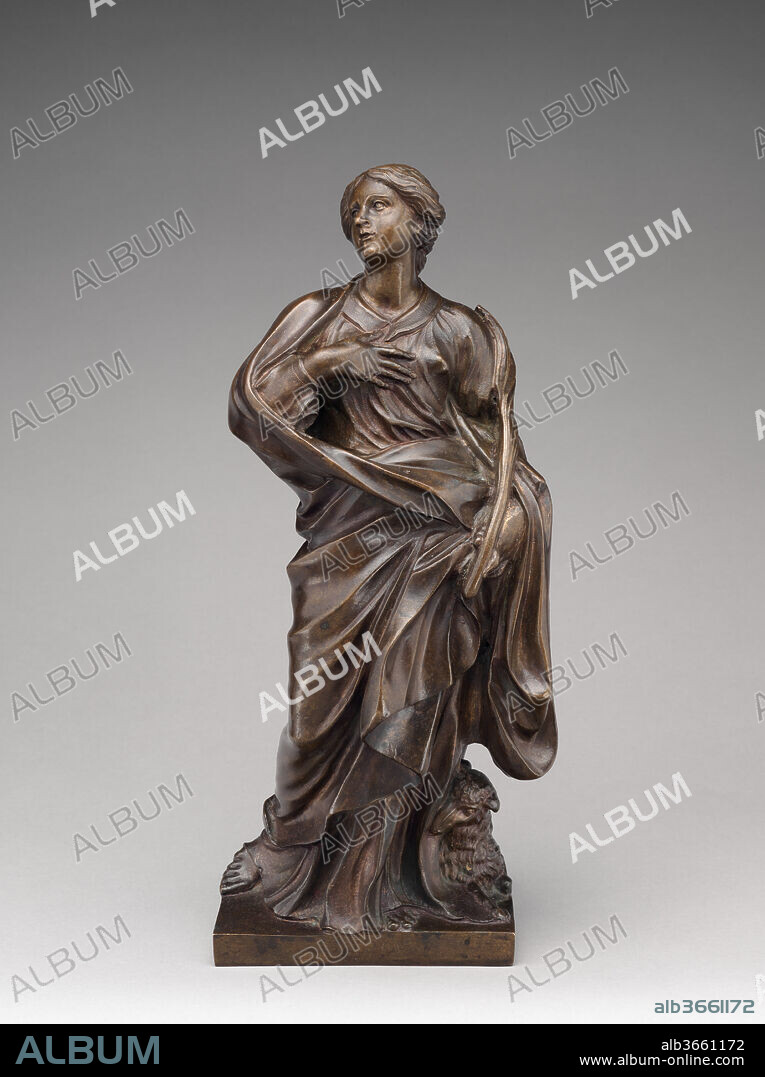 Saint Agnes. Artist: After a model by Gian Lorenzo Bernini (Italian, Naples 1598-1680 Rome). Culture: Italian, Rome. Dimensions: Overall (confirmed): 13 15/16 × 6 × 5 7/8 in. (35.4 × 15.2 × 14.9 cm). Date: third quarter 17th century.
The saint is shown standing, her gaze lifted to heaven to emphasize her ecstatic expression. She wears a robe and heavy cloak and holds a palm symbolizing her martyrdom. A lamb, symbol of Saint Agnes, is depicted crouching at her feet. Another example of this statuette is in the Chapel of Palazzo Doria, Rome.