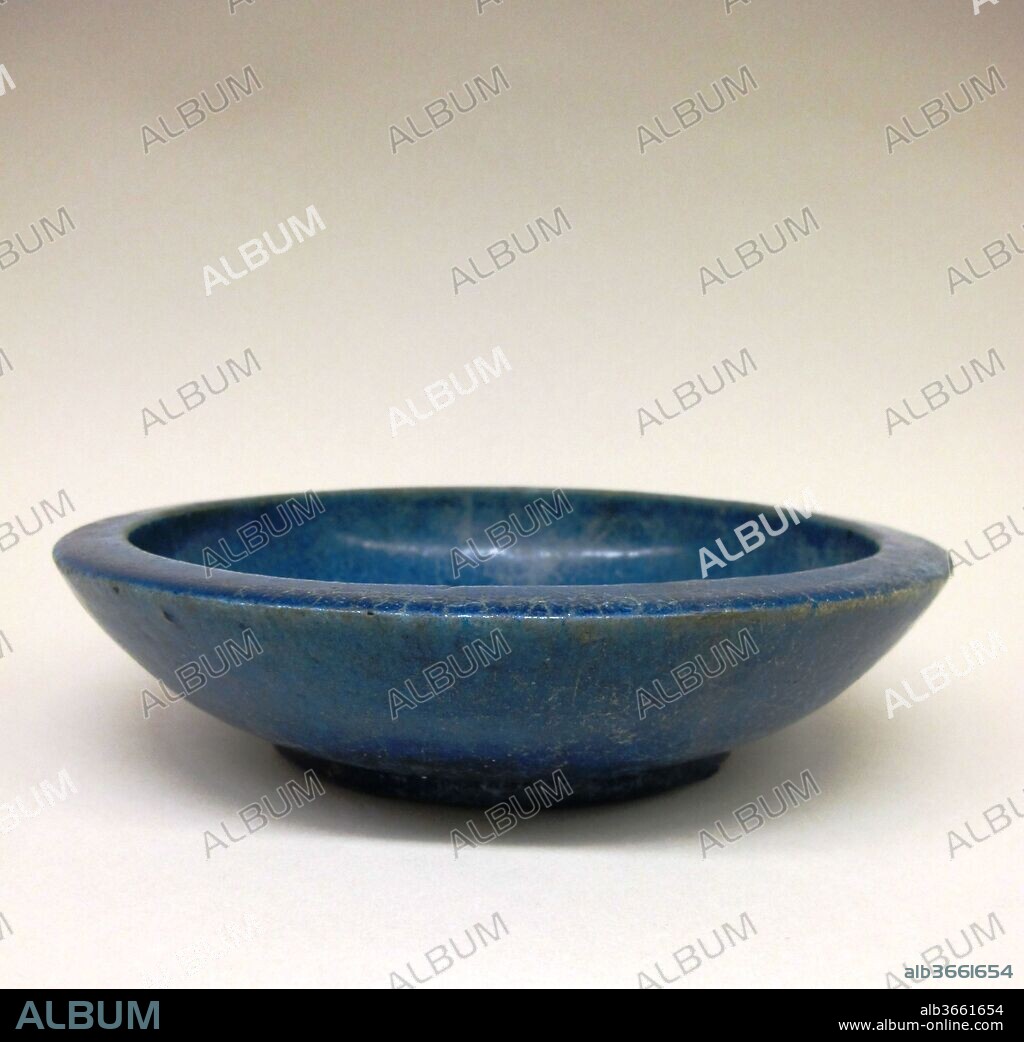 Faience bowl. Culture: Ptolemaic. Dimensions: Diam.: 8 11/16 in. (22 cm). Date: 332-30 B.C..
This bowl, preserved intact, is a fine example of Egyptian faience ware. The Egyptians mastered the production of this luxury ware as early as the late Predynastic period (late fourth millennium B.C.). Faience continued to be used for both sacred and secular objects into Hellenistic and Roman times.