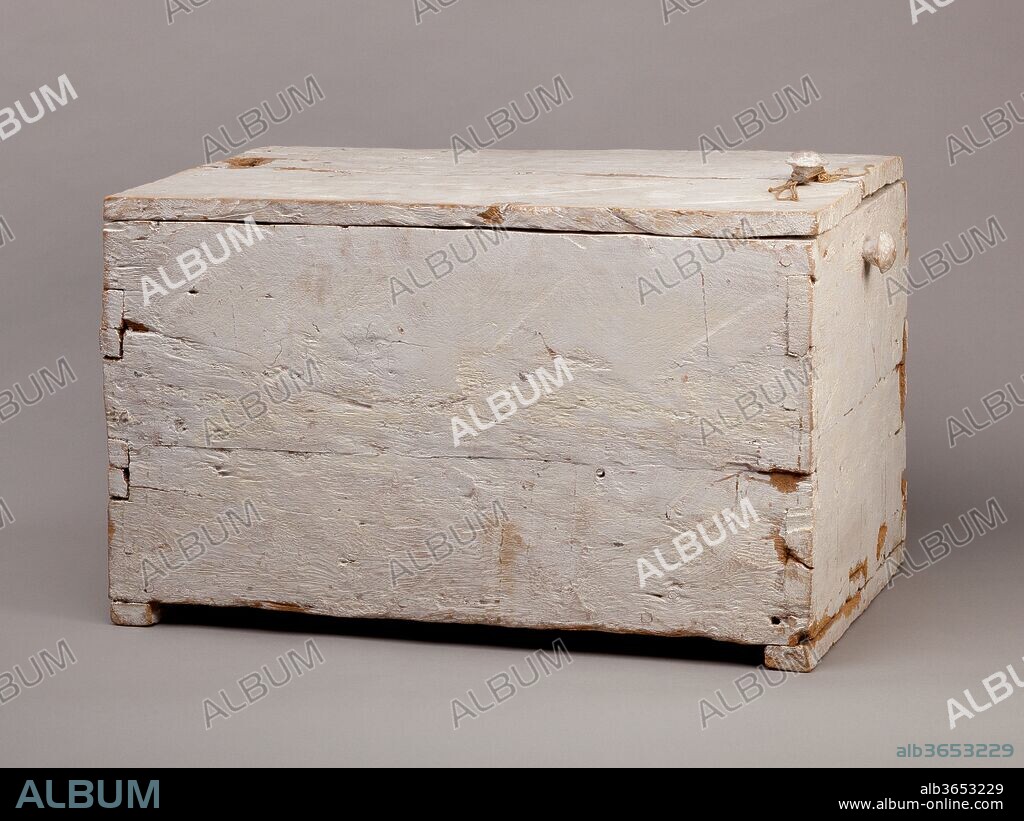 Rectangular Linen Chest. Dimensions: L. 75 cm (29 1/2 in.); W. 46.5 cm (18 5/16 in.); H. 46.5 cm (18 5/16 in.); Th. of boards 2-2.5 cm (13/16-1 in.). Dynasty: Dynasty 18, early. Reign: reign of Thutmose II-Early Joint reign. Date: ca. 1492-1473 B.C..
This simple rectangular box with a flat lid was whitewashed inside and out. Two battens on the underside of the lid hold it in place when closed and battens on the bottom of the box hold it above the floor surface. The box is made of sycamore and the two knobs at the front (one on the box and one on the lid are made of a harder wood, perhaps tamarisk. A length of linen cord was wound around these knobs and a piece of mud applied to the cord was impressed with a square seal.
Inside the box were 25 linen sheets, the majority of which had been used before being buried in Hatnefer's tomb (36.3.1).  A number of the sheets had ink inscriptions (see 36.3 151). All but one of the sheets had been cleaned and most were folded into small bundles and carefully packed into the box. At the top, several sheets had been partially folded placed in the box, and pushed down around the edges of the sheets below.