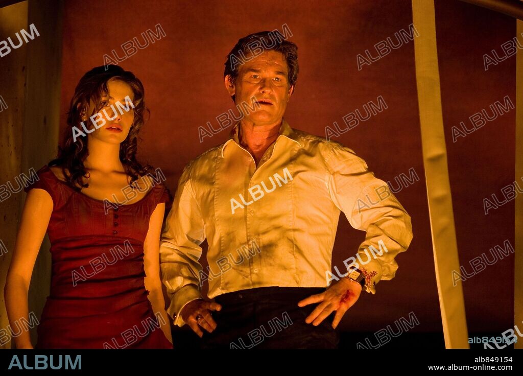 EMMY ROSSUM and KURT RUSSELL in POSEIDON, 2006, directed by WOLFGANG PETERSEN. Copyright WARNER BROS. / BARIUS, CLAUDETTE.