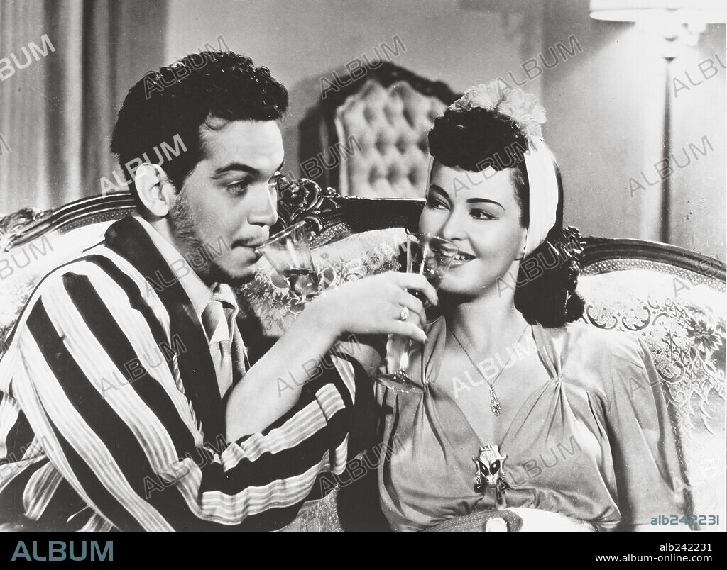 CANTINFLAS and MAPY CORTES in THE UNKNOWN POLICEMAN, 1941 (EL GENDARME DESCONOCIDO), directed by MIGUEL M. DELGADO. Copyright POSA FILMS, S.A.