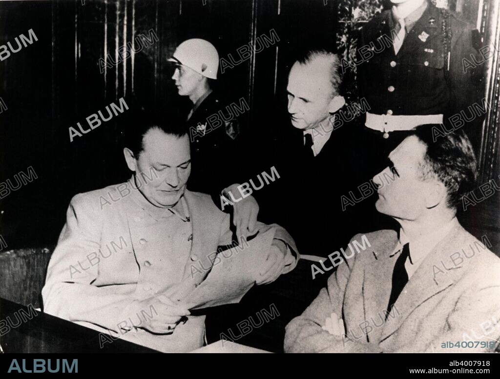 Nazi leaders Hermann Göring and Rudolf Hess at the Nuremberg Trials, Germany, c1945-c1946. Between 20 November 1945 and 1 October 1946 the 24 surviving most senior Nazi leaders were tried before the International Military Tribunal in the Palace of Justice in Nuremberg. Hess (1894-1987), Hitler's deputy received a sentence of life imprisonment, dying in Spandau prison in Berlin after serving 41 years. Göring (1893-1946), the commander of the Luftwaffe, was sentenced to death, although he committed suicide before he could be executed.