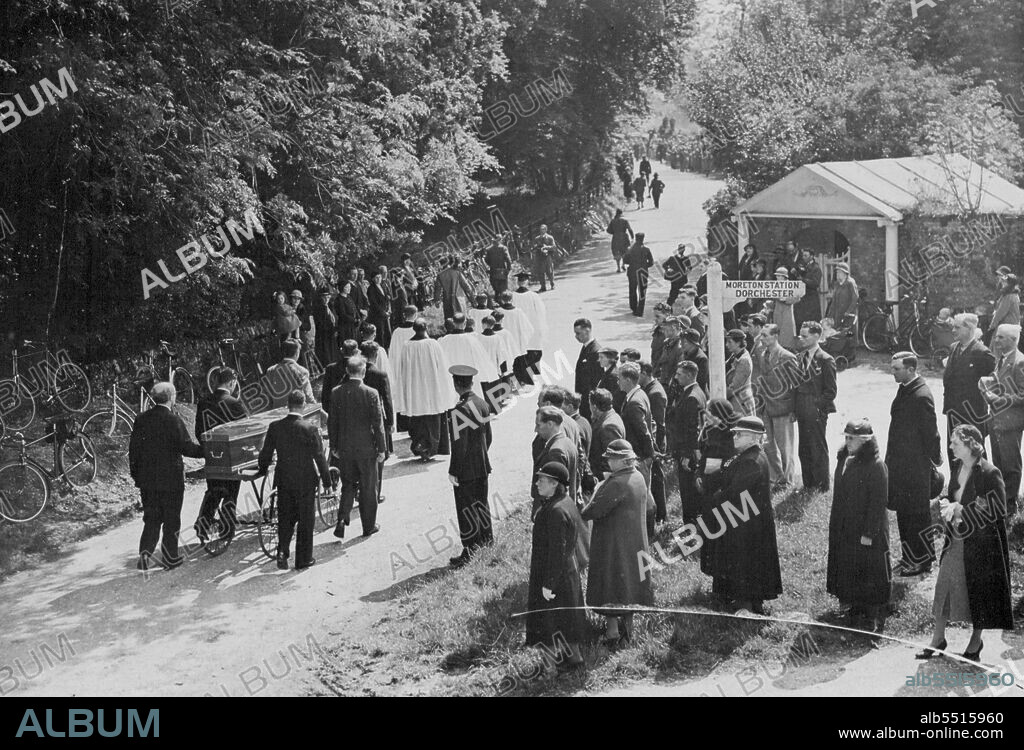 Funeral Of Lawrence Of Arabia -- The simple scene as the coffin passed through leafy lanes on its way to the church.
Lawrence of Arabia - Mr. T.E. Shaw - who died from the injuries received in a recent motor-cycle accident, was buried to-day at the village church of Moreton, Dorset. There were nomflowers, and only the simplest ceremony, attended mainly by friends. May 21, 1935. (Photo by Topical Press).