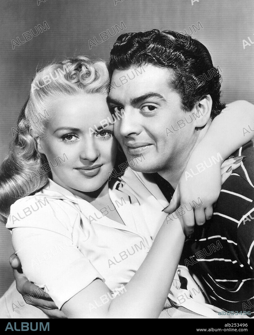 BETTY GRABLE and VICTOR MATURE in SONG OF THE ISLANDS, 1942, directed by  WALTER LANG. Copyright 20TH CENTURY FOX. - Album alb253496