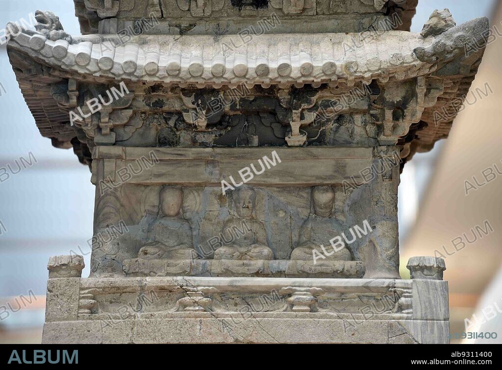 Goryeo, Korea: Ten-story Stone Pagoda, the 8th stone. 1348, traditional tower, the Yuan Dynasty (China) style. Each floor has a different content, taken away by Japan in 1907 and returned to Korea in 1918. Goryeo (918-1392), the dynasty after three kingdoms period before the Joseon dynasty. There are three statues of Buddha on the 8th stone.