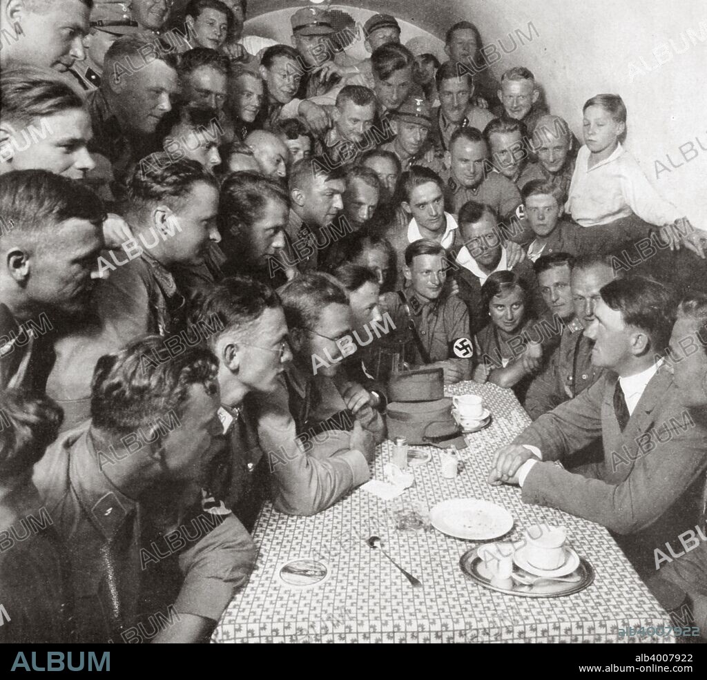 'The supreme SA leader Adolf Hitler with his comrades', 1938. Founded in c1919, the Sturmabteilung (SA) was the paramilitary wing of the Nazi party. Its members were known as the 'Brownshirts' because of the colour of their uniforms. The SA played an important part in Hitler's (1889-1945) rise to power in Germany but its significance was effectively ended when its leaders were killed in the 'Night of the Long Knives' in 1934, with the rival Schutzstaffel (SS) taking over its role. From Geschichte der SA (History of the SA) by Wilhelm Rehm, published by Franz Eher Nachf, 1938.