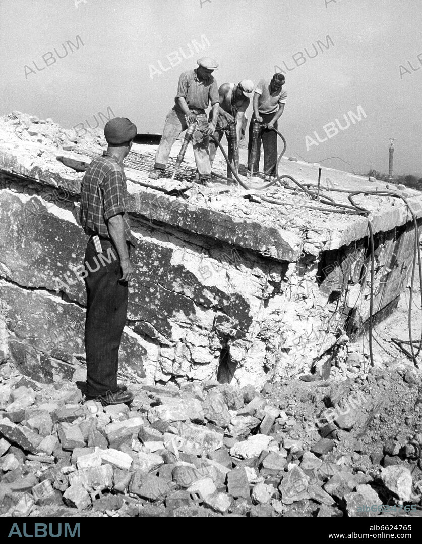 Construction worker during the removal of the "Zoobunkers"in Berlin 1955. The site of the Flak-bunkers will be part of the new zoo after the demolition. It was called "Zoobunker" due to the nearness to a zoologic garden. 1955