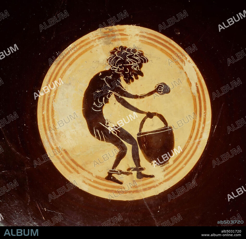 Attic black-figure kylix or cup type sub-A. Decoration on outside of Dionysos acompanied by satyrs, In tondo a caricature of a black slave, holding bucket and sponge. Leafless group, Caylus Painter (late) Attic black-figured kylix or cup type sub-A with representations on A and B: Dionyos flanked by a satyr on foot and a satyr riding on an ithyphic ass. Wingerd in the field, under the handles dolphins. In the tondo a caricature image of a black slave, holding a bucket and a sponge., Vase, kylix, cup type sub-A, pottery, black-figured, Attic, 7.6 cm, ø 19.5 cm, black-figured, Attic, Leafless Group, Caylus 490-480 BC, Italy, Greece.
