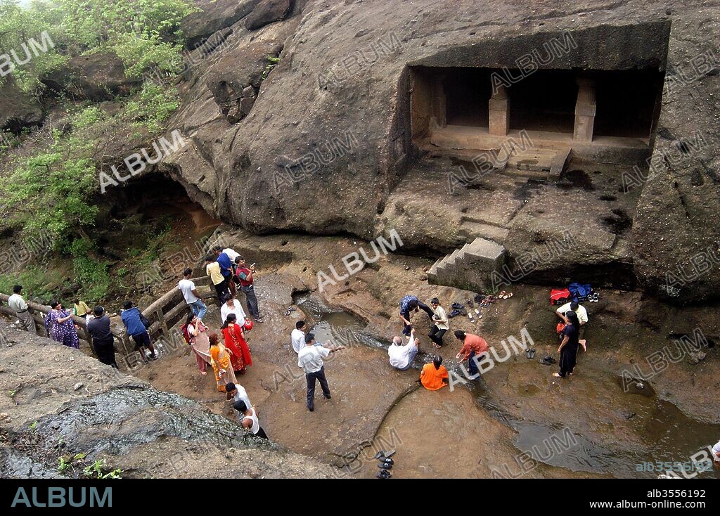 Tourists at Buddhist Kanheri Caves inside the Sanjay Gandhi National Park , Mumbai Bombay , Maharashtra, India.