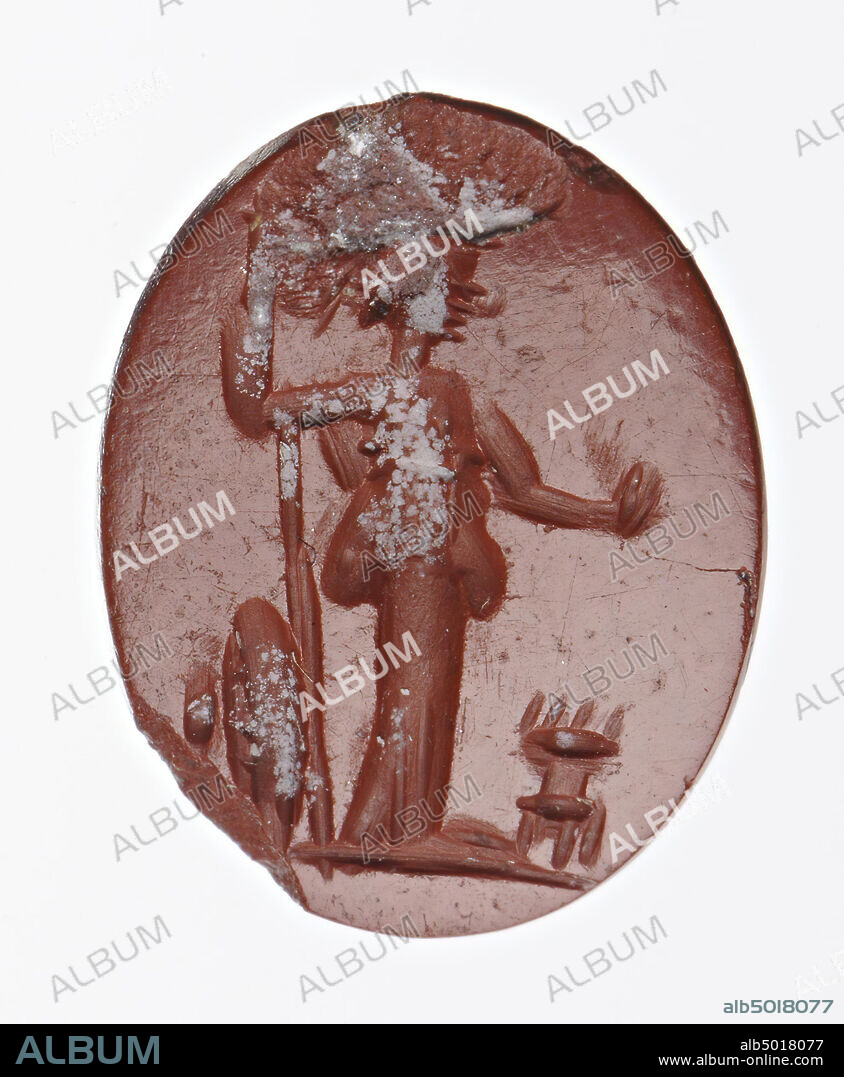 Vz: the goddess is standing with a patera in her left hand and an altar at her feet., Gem, intaglio, ringstone, jasper, Color: red, Shape: oval, Processing: edge cut back at the back compared to at the front, Method: body modeling with two types or rounded drills, detailing with one type or rounded wheel grooves, 14 x 10.5 mm, D. 3,5 mm, 2nd - 3rd century AD. 100-300 AD.