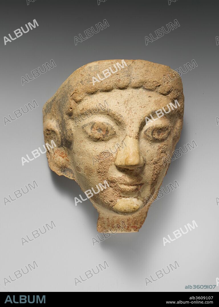 Terracotta antefix (roof tile) with female head. Culture: Etruscan, Cerveteri. Dimensions: Overall: 7 7/16 x 6 5/8in. (18.9 x 16.8cm). Date: 5th century B.C..